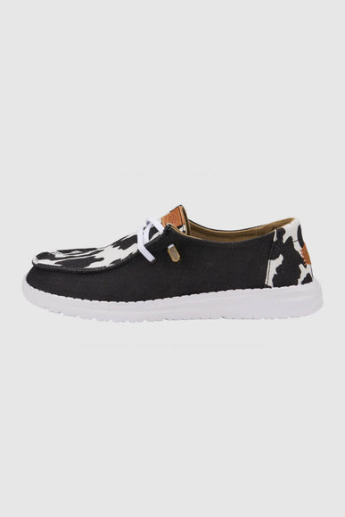 HEYDUDE Women’s Wendy Cow Print Shoes in Black/White