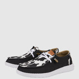 HEYDUDE Women’s Wendy Cow Print Shoes in Black/White