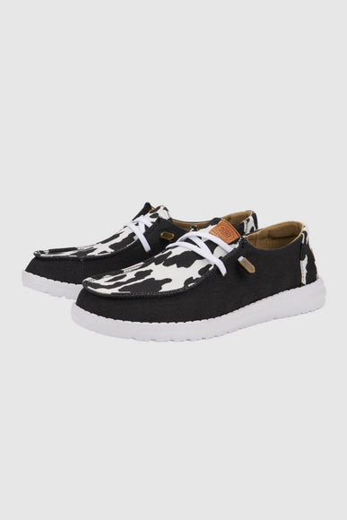 HEYDUDE Women’s Wendy Cow Print Shoes in Black/White