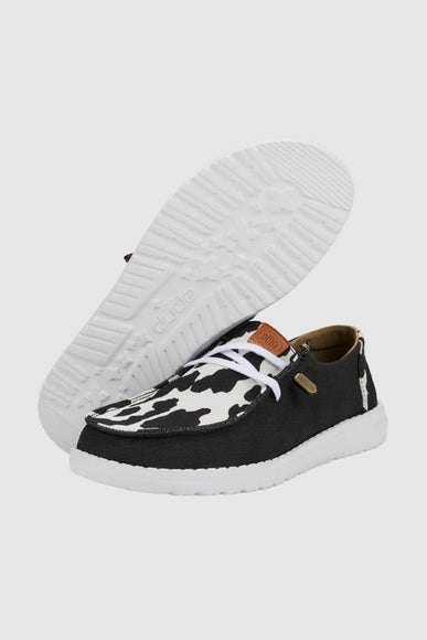 HEYDUDE Women’s Wendy Cow Print Shoes in Black/White