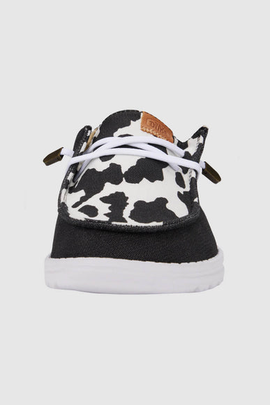 HEYDUDE Women’s Wendy Cow Print Shoes in Black/White