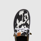 HEYDUDE Women’s Wendy Cow Print Shoes in Black/White