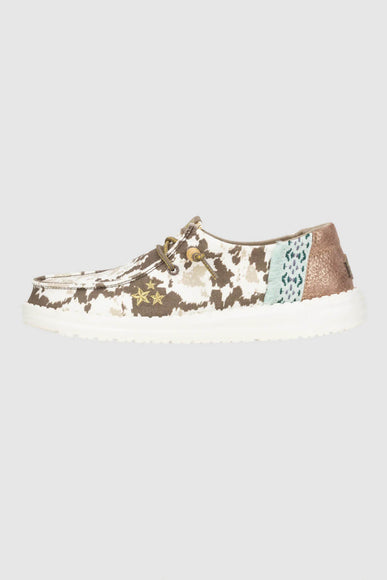 HEYDUDE Women’s Wendy Disco Cow Print Shoes in Tan